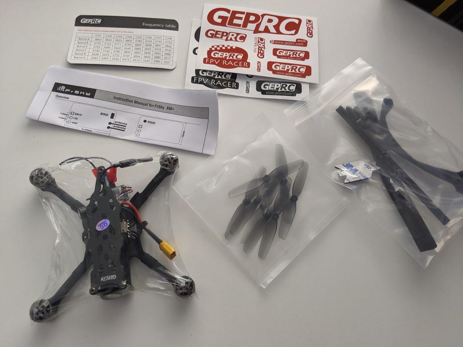 GEPRC Phantom quad and parts on the table