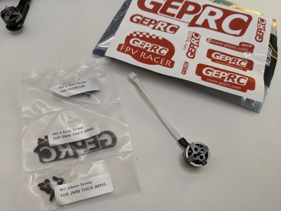 GEPRC Phantom motor and spare screws, stickers