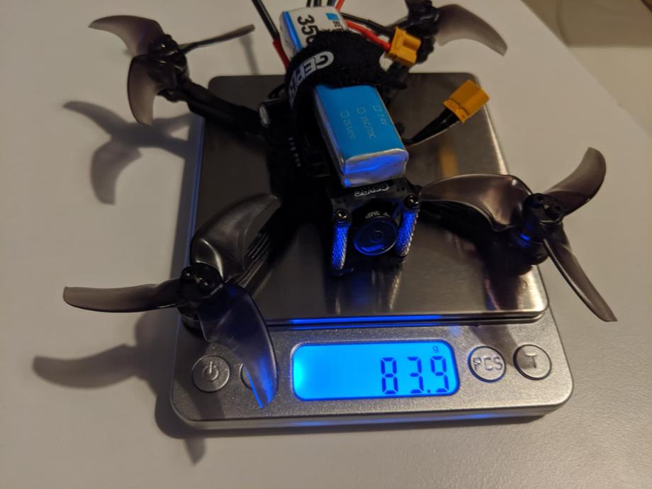 GEPRC Phantom on a scale weighing 83.9 grams with a battery