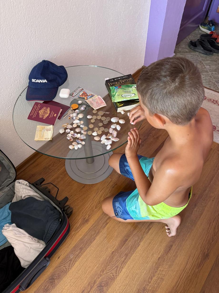 Anton playing with seashells