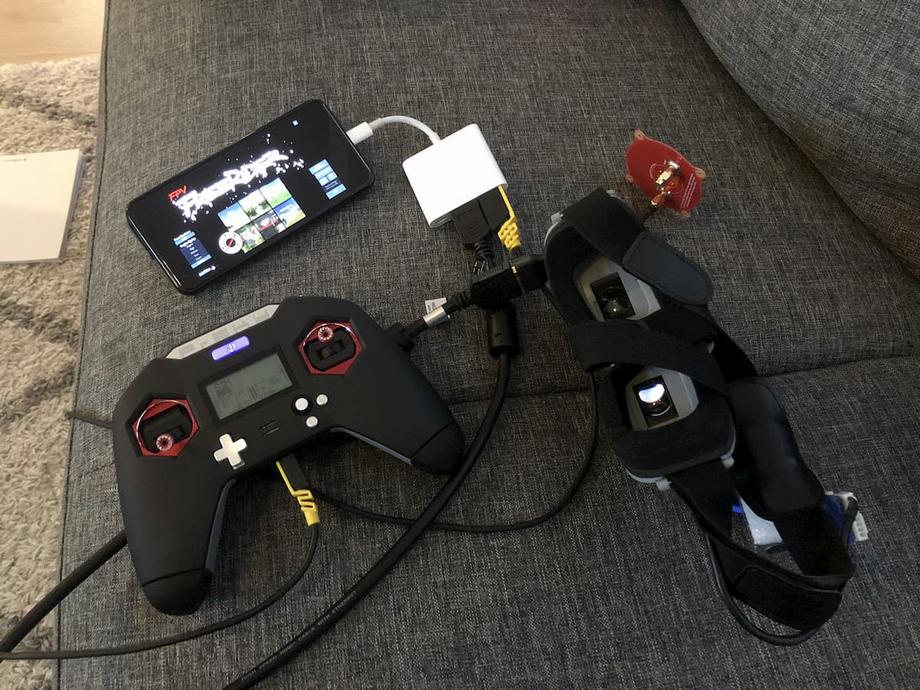 Taranis X-Lite and Aomway Commander goggles plugged into a USB C dongle, plugged into a Pixel 3