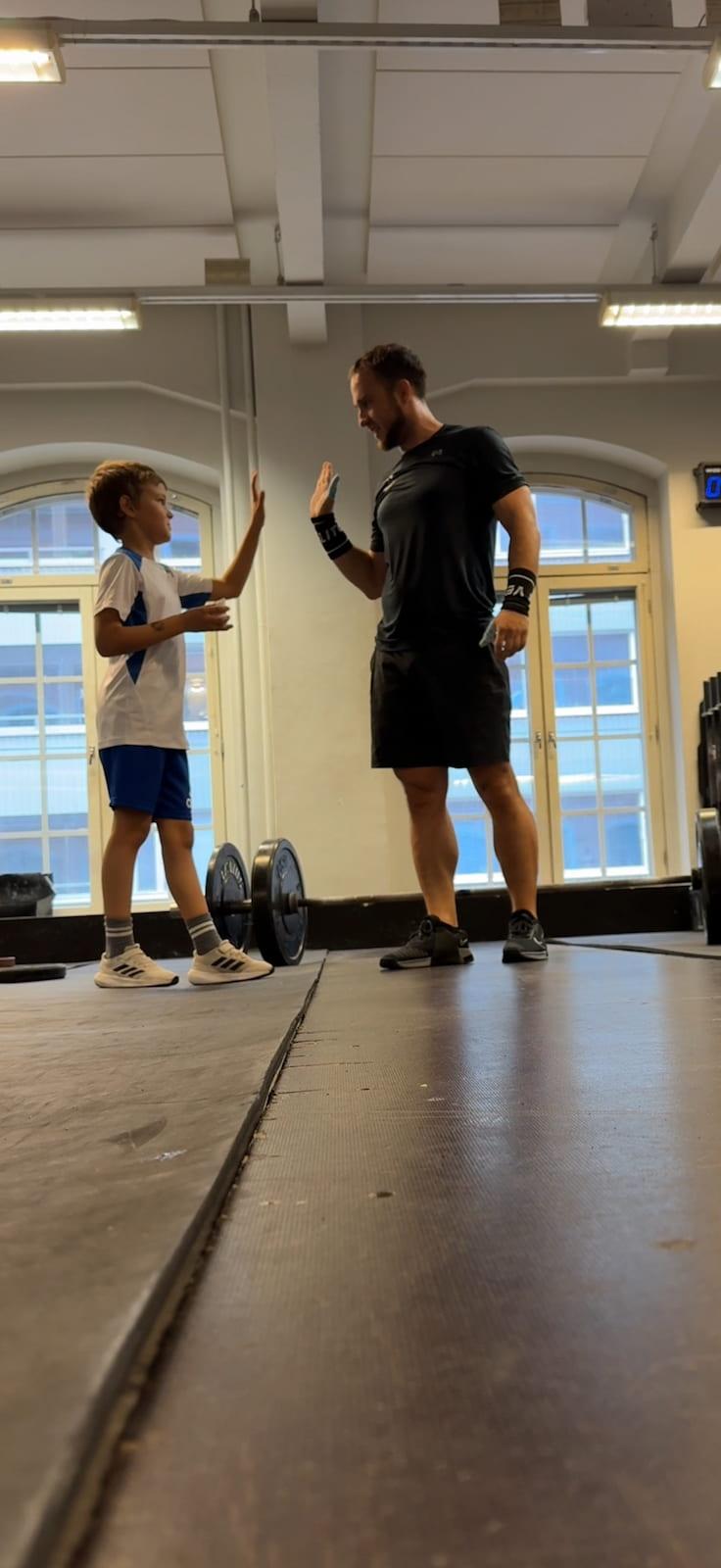 High 5 son at the gym