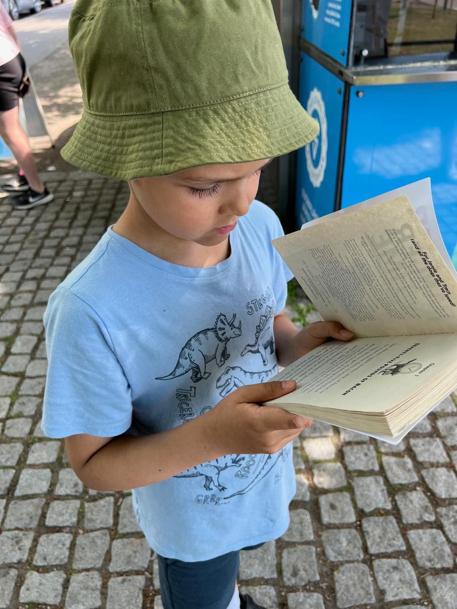 Anton reading outside