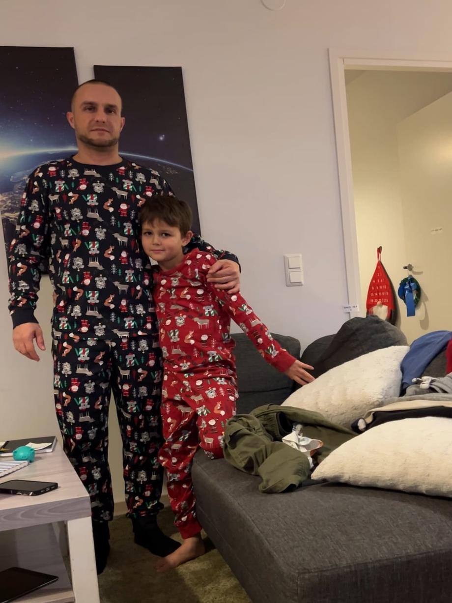 Anton and dad with xmas pajamas