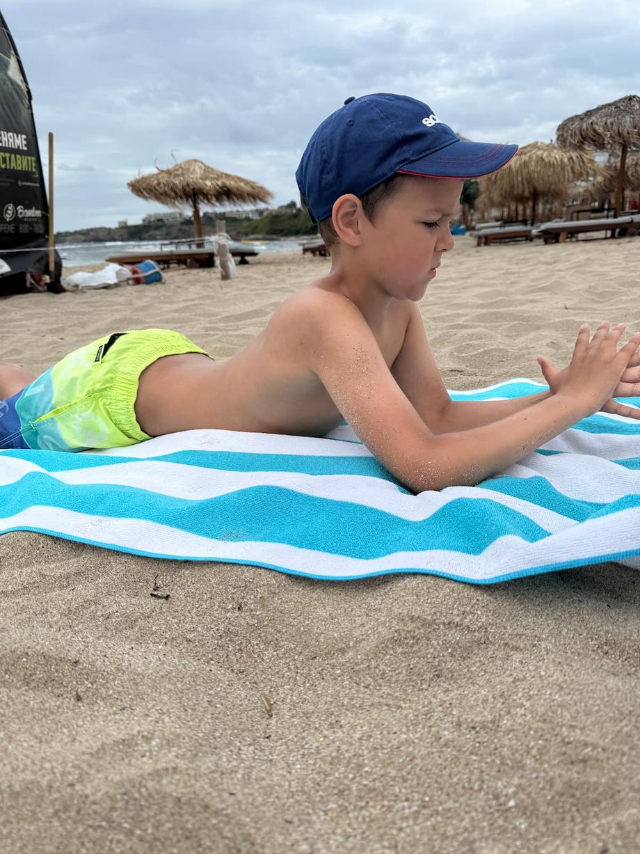 Anton chilling on beach towel